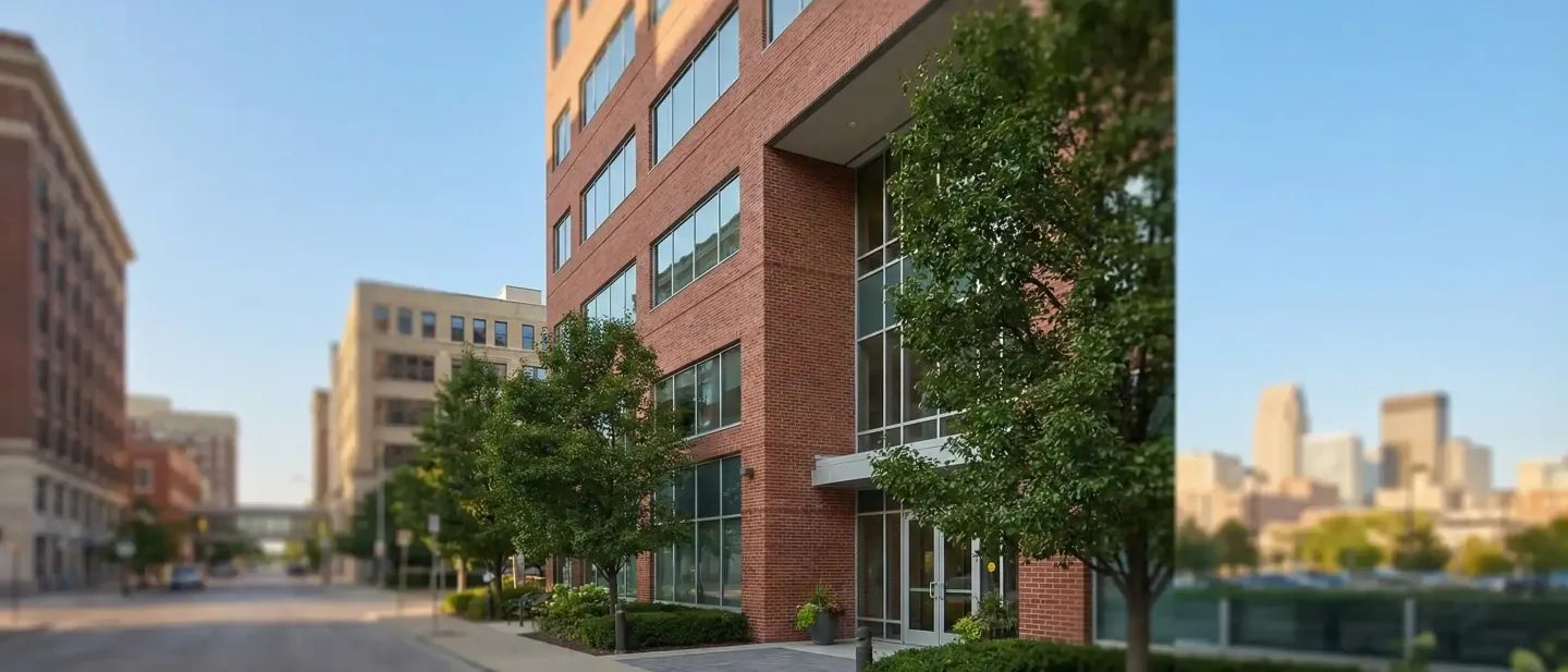 Professional law office consultation room with attorney and clients in Omaha, NE