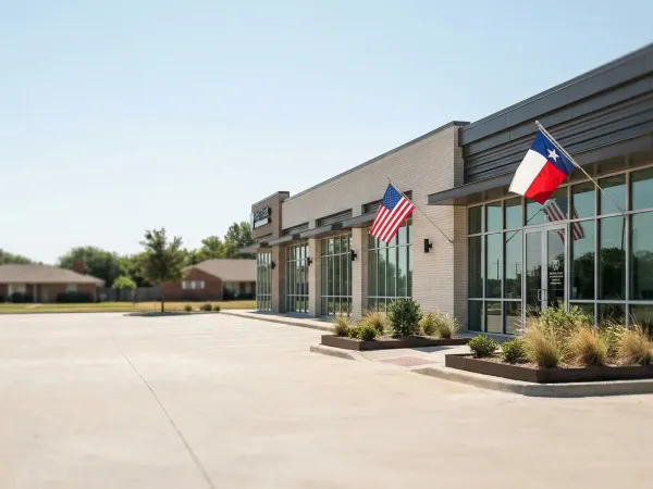 Professional dental operatory in a Garland, TX practice with bilingual patient intake materials and digital X-ray display
