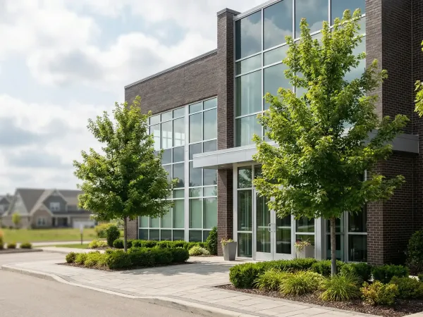 Modern dental practice interior in Grand Rapids, MI — smiling hygienist with patient, bright clean operatory