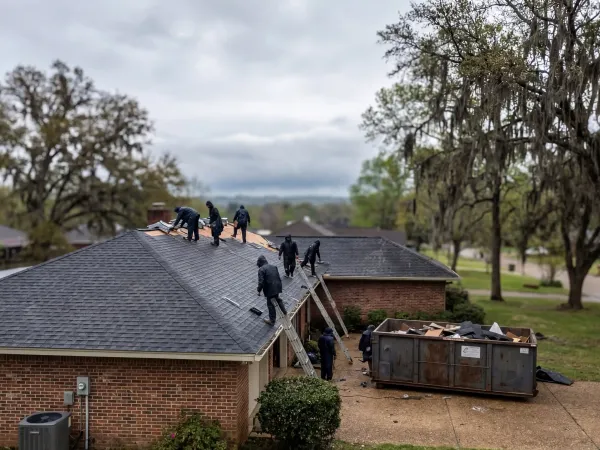 Licensed roofing contractor inspecting storm damage on a residential home in Shreveport, Louisiana